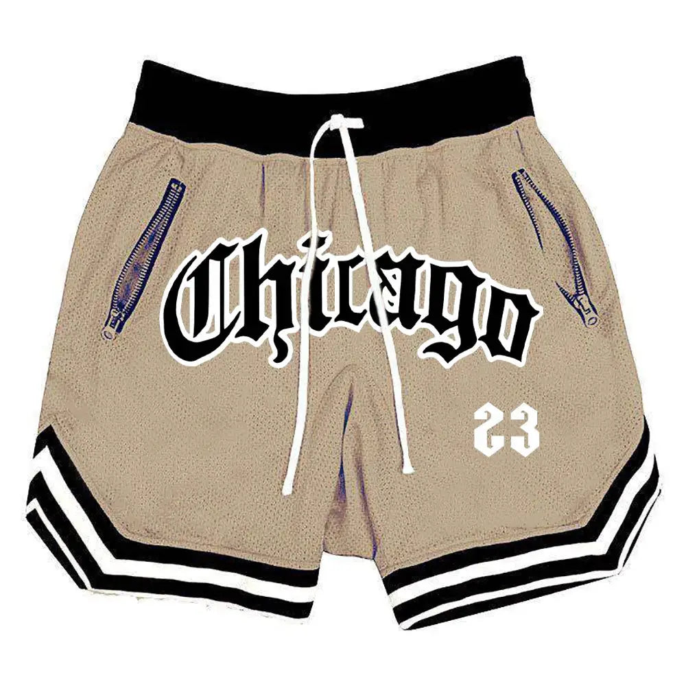 Men's tan quick-drying sports shorts with Chicago graphic, black elastic waistband, zip pockets, and striped hem
