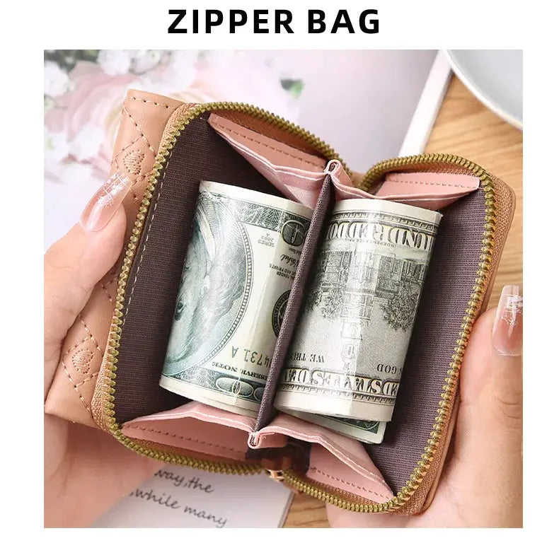 Women's pink quilted zipper wallet with gold zipper; large-capacity card bag with rolled cash inside.