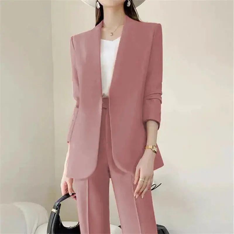 Two-piece pink women's suit set with blazer and pants, elegant commuter style.
