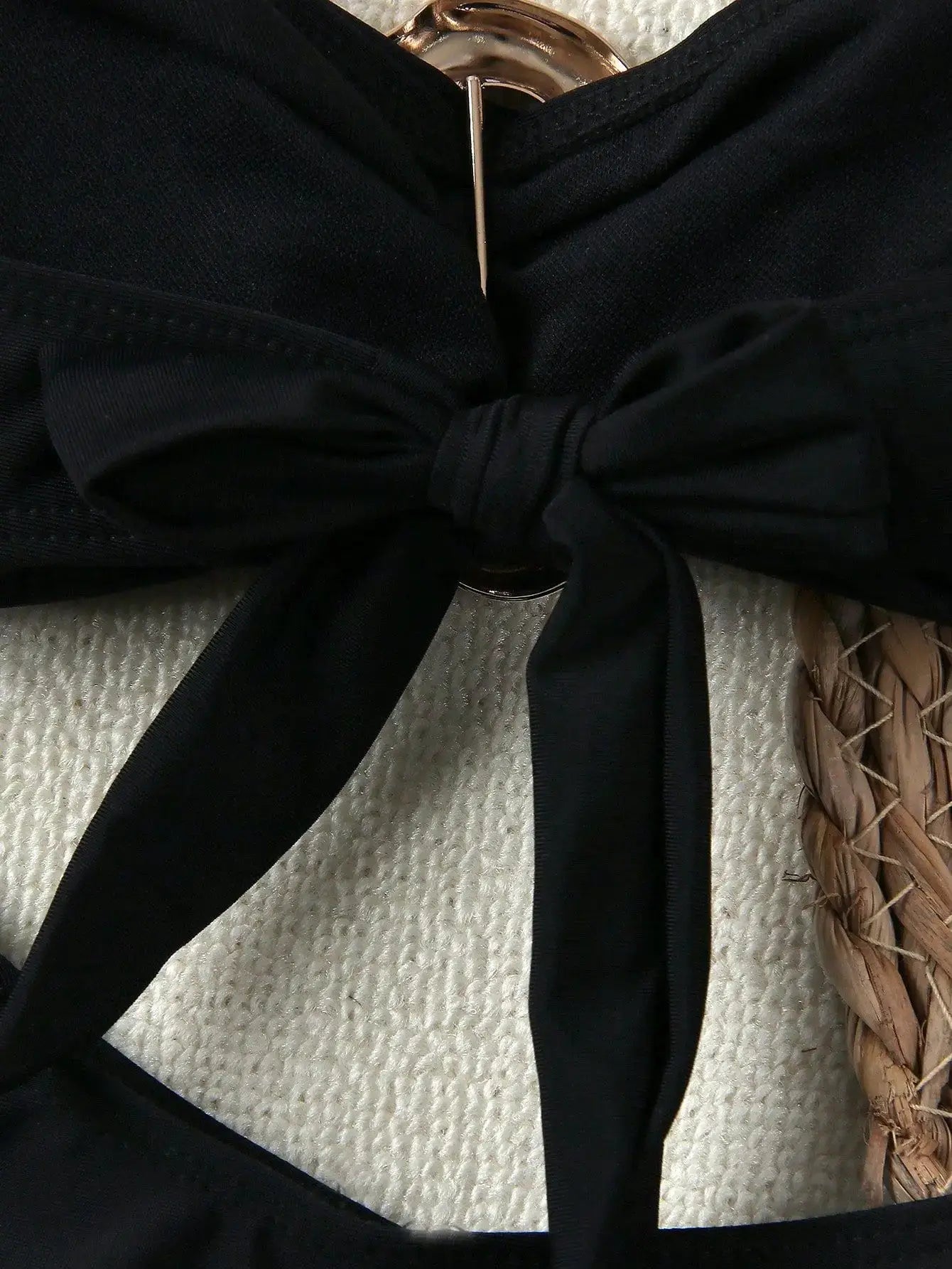 Bandeau bikini top in black with front knot detail and metal ring centerpiece