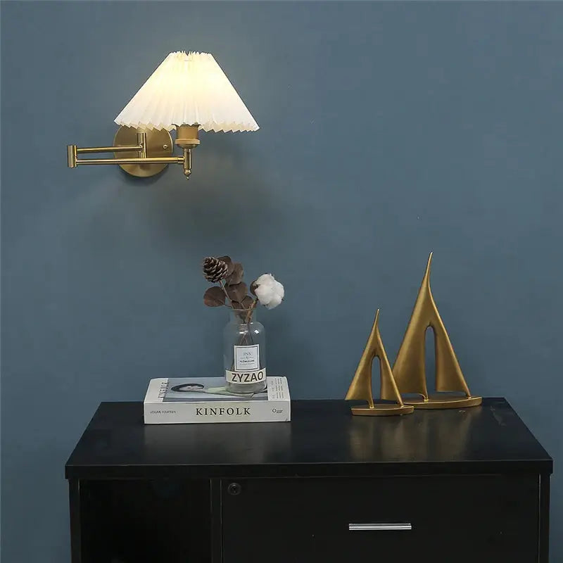 Nordic adjustable folding LED wall lamp with brass finish and white pleated shade.
