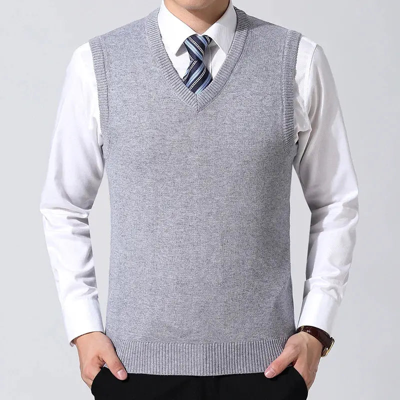 Men's casual sweater vest by Simples Market in light gray, worn over a white dress shirt with a striped tie