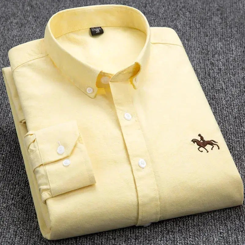 Men's light yellow cotton oxford shirt, long sleeve with white buttons and small horse logo.