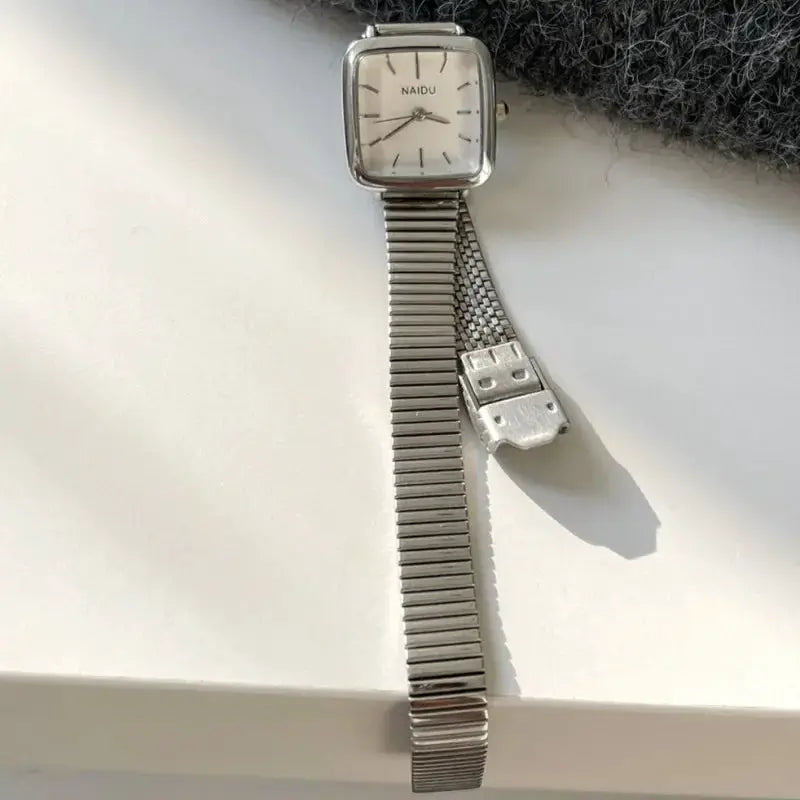 Women's stainless steel square-face quartz watch from NAIDU with adjustable metal bracelet and small dial