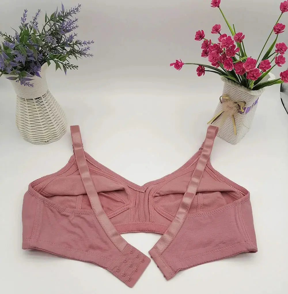 Pink plus-size seamless bra with wide straps and back hook closures