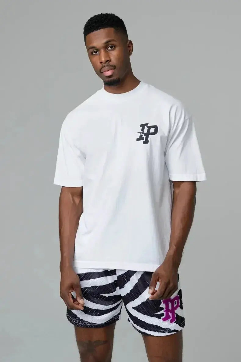 Men's zebra-print athletic shorts with black and white stripes and pink LP logo