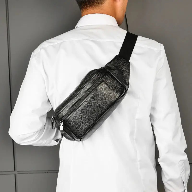 Men's black genuine leather chest bag crossbody by Simples Market with dual zip pockets