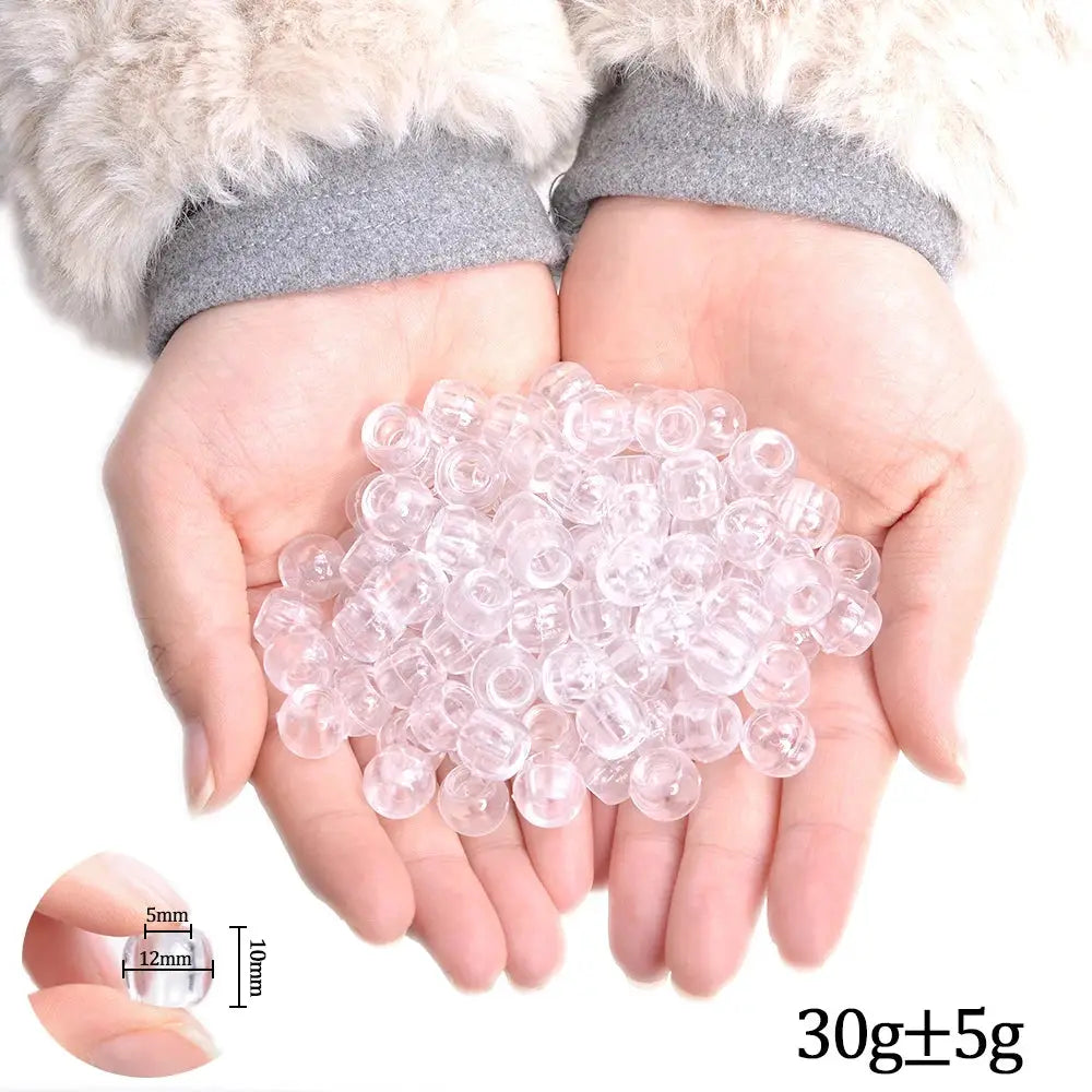 Hair braiding beads; clear plastic beads held in hands, 30g ±5g.