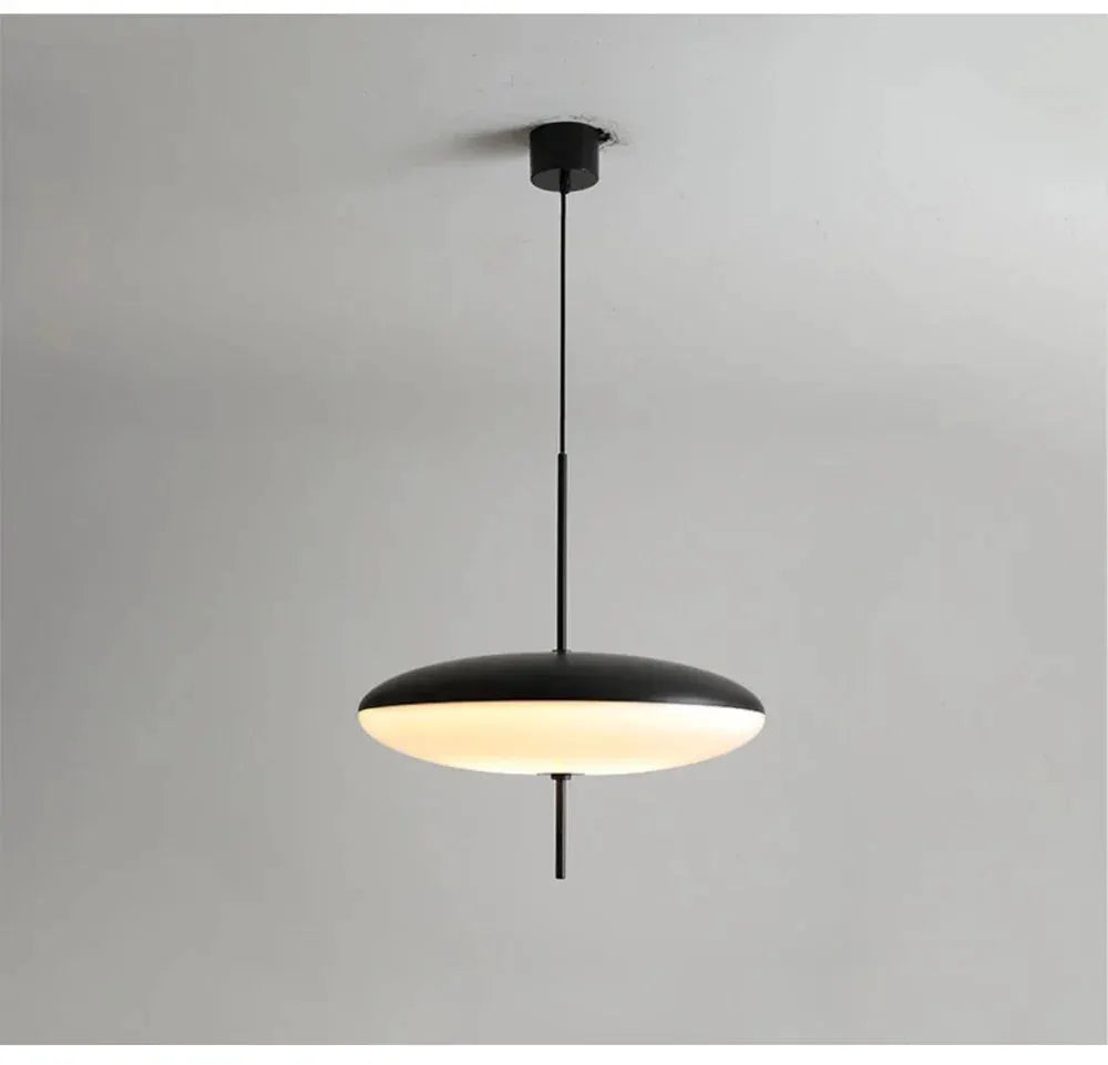 Nordic LED pendant lamp with flying saucer design, black exterior and white diffused underside.