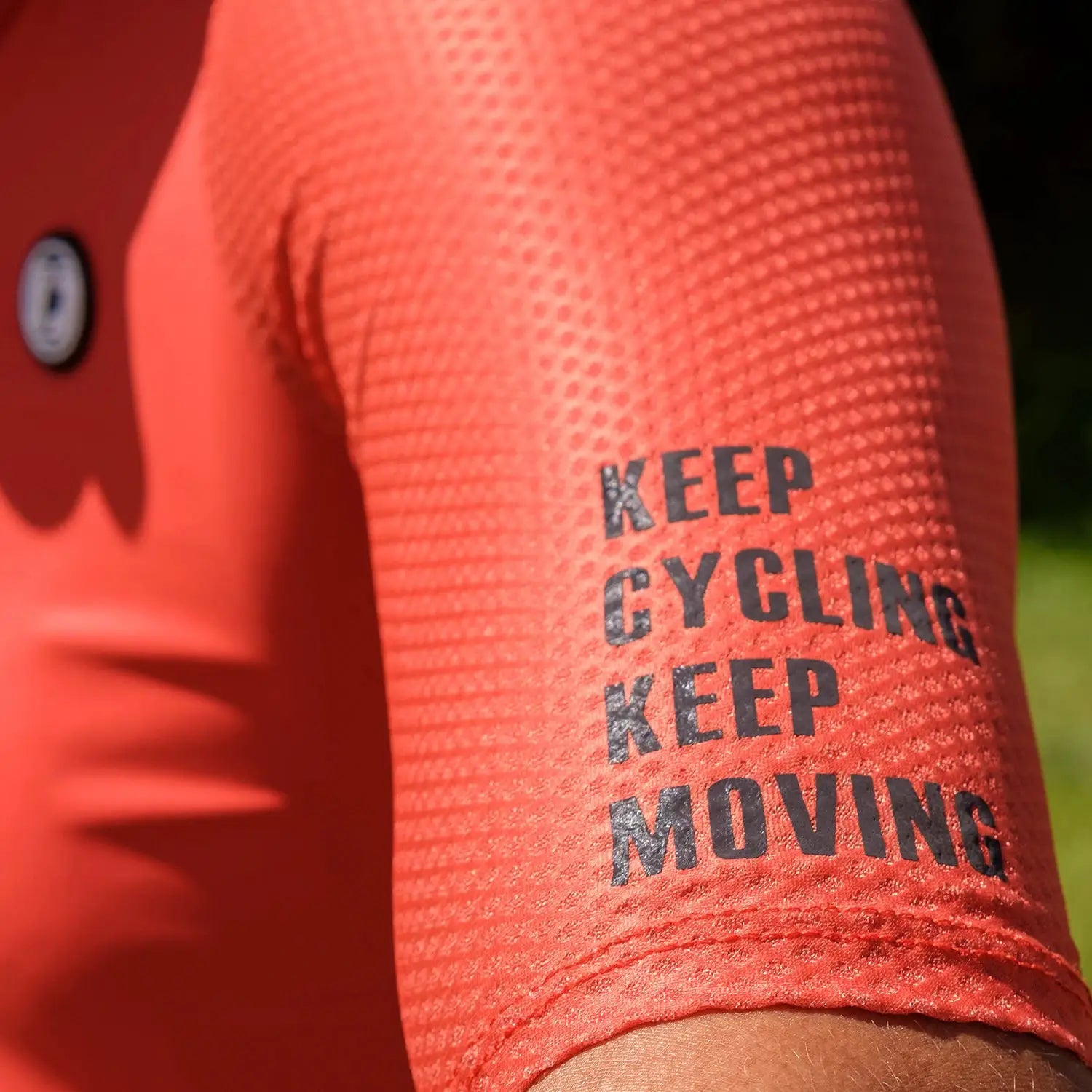 DAREVIE cycling jersey sleeve in red breathable mesh textured fabric long-sleeve with KEEP CYCLING MOVING print