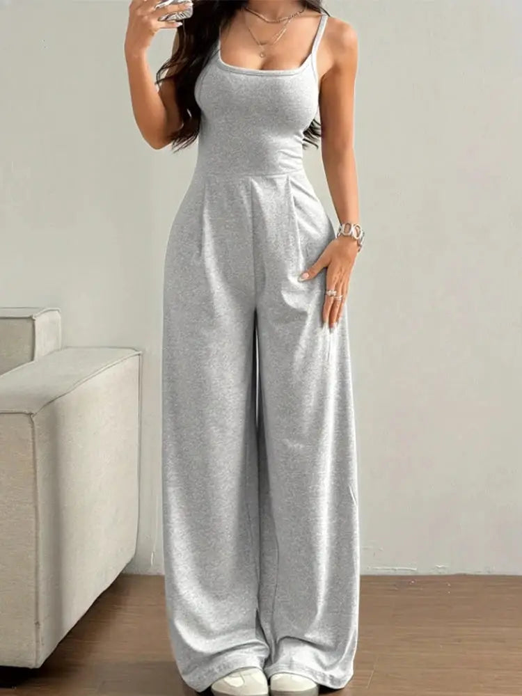 Women's grey halter-neck sleeveless jumpsuit with wide-leg floor-length pants, solid color.