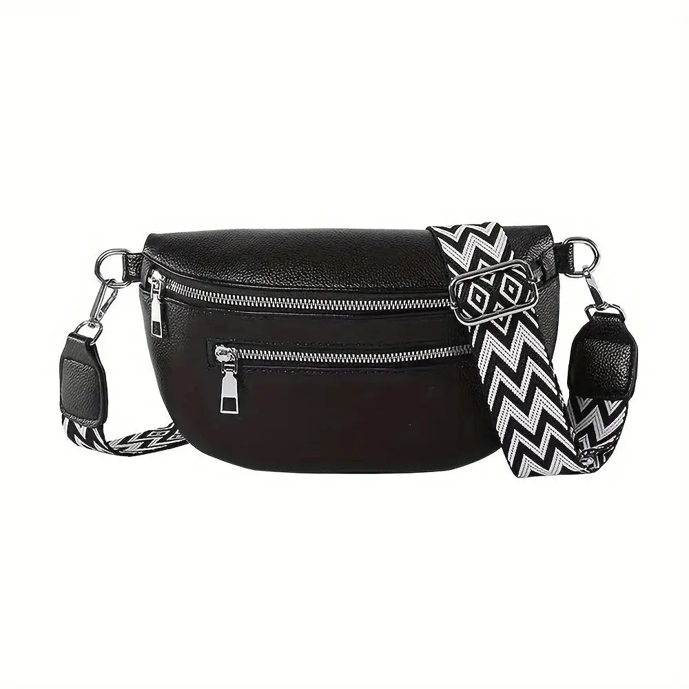 Soft leather black fanny pack with two zip pockets and a black-and-white zigzag crossbody strap