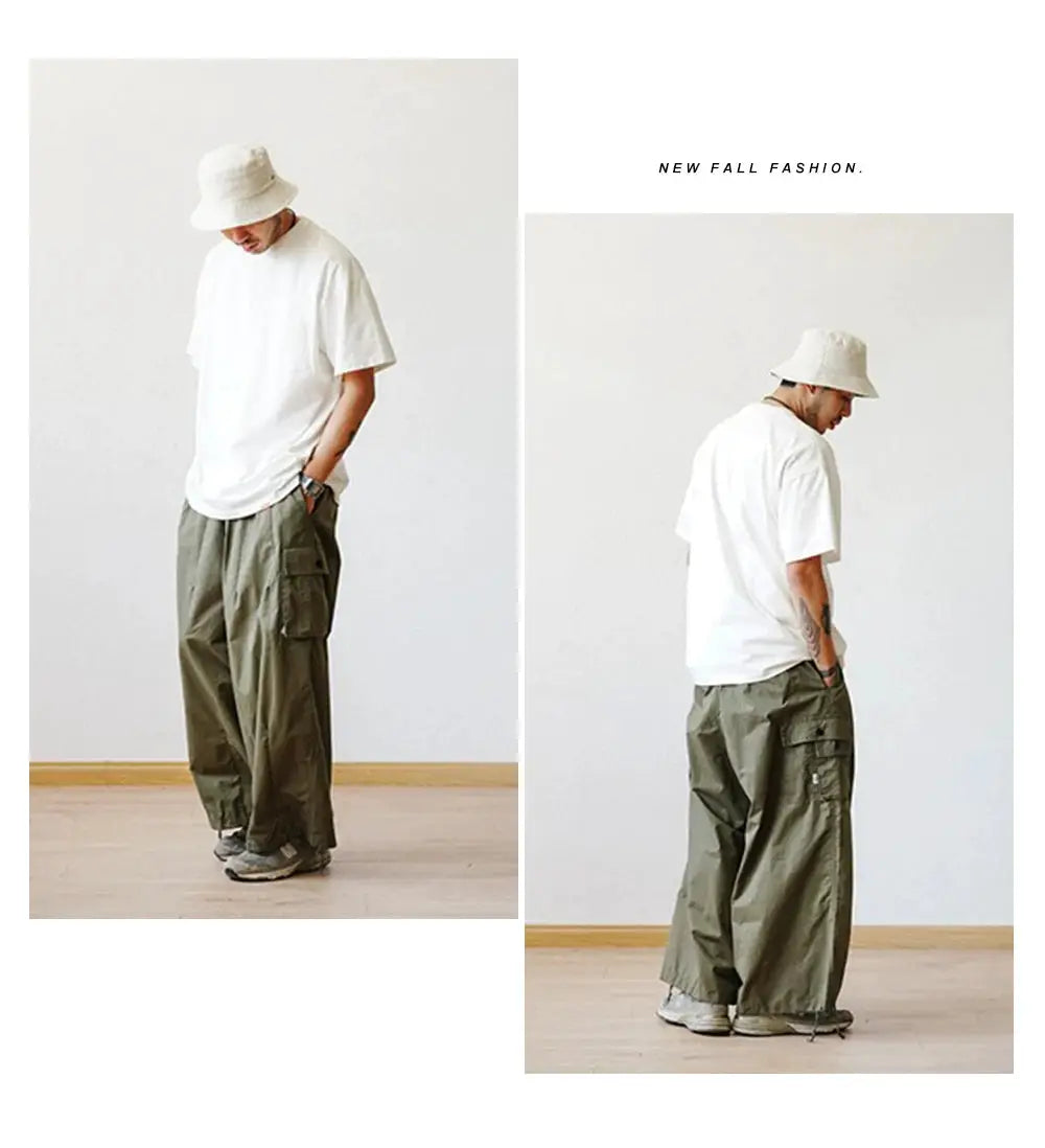Oversized cargo pants by Simples Market in olive green with multiple pockets and wide-leg ankle-length.