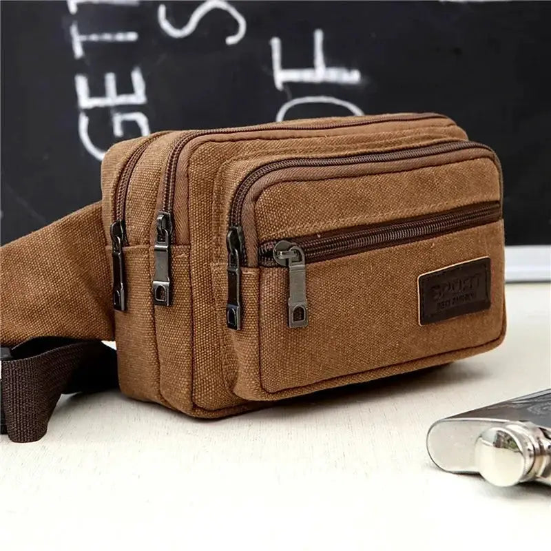 Simples Market canvas waist bag in brown with multiple zip pockets and adjustable strap.