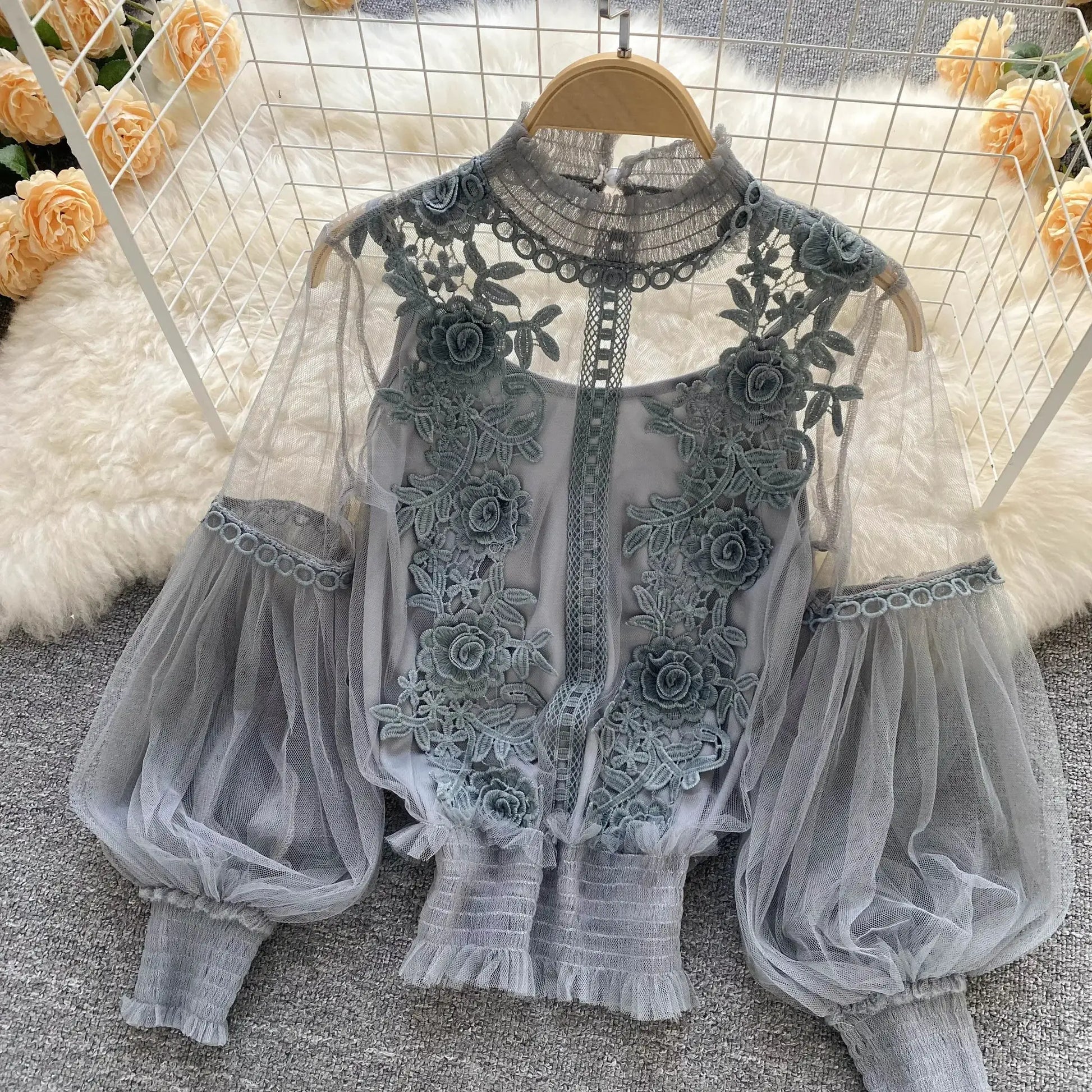 Lace puff long-sleeve blouse in gray with floral embroidery and sheer tulle panels.