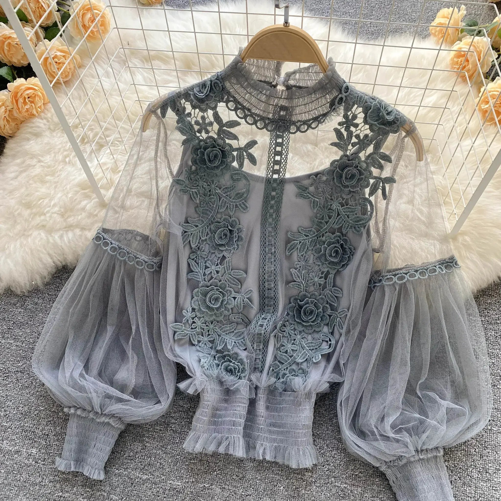 Lace puff long-sleeve blouse in gray with floral embroidery and sheer tulle panels.