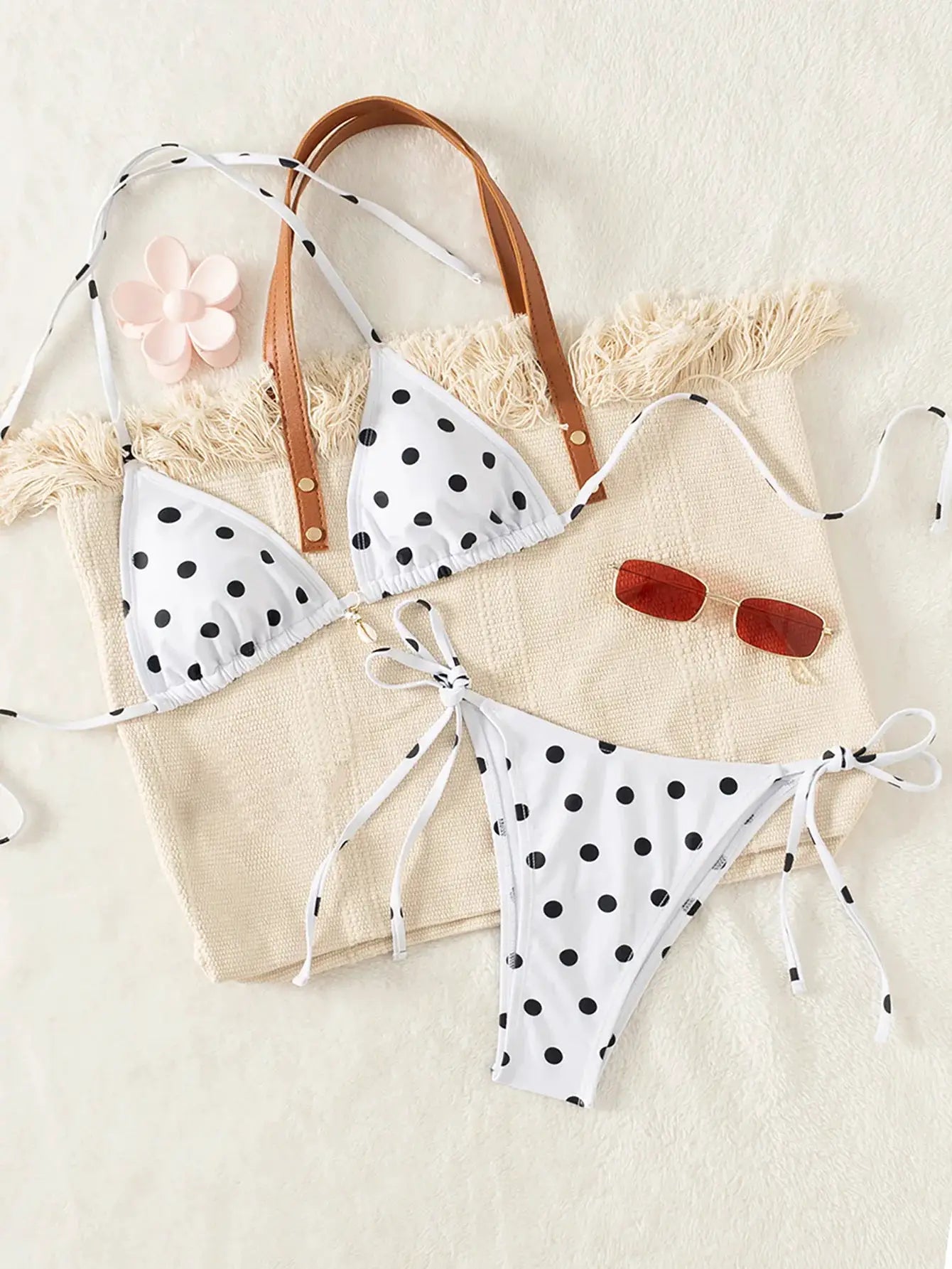 Women's bikini set by Simples Market; white polka-dot two-piece with triangle top and tie-side bottoms, brown straps.