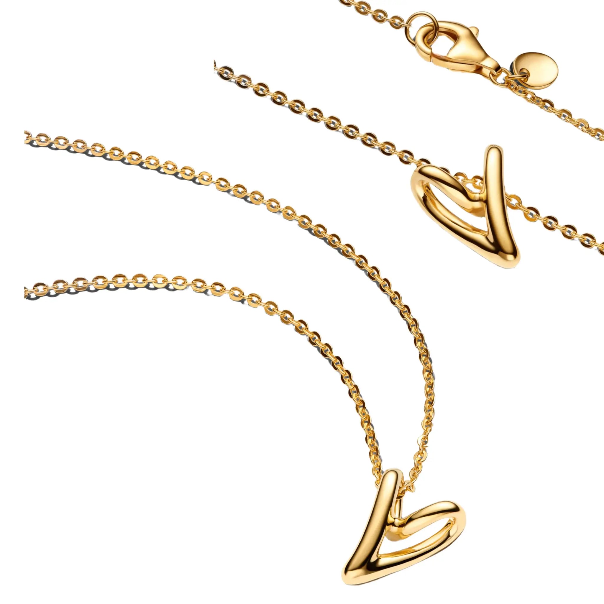 Gold-tone necklace with a smooth curved abstract pendant on a delicate chain with lobster clasp.