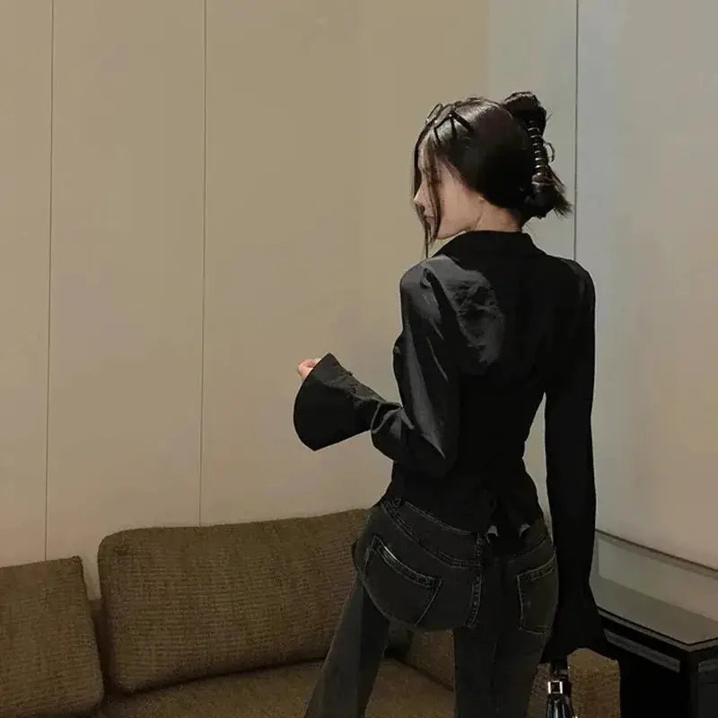 Bandage blouse for women, black long-sleeve top with bell cuffs, back view