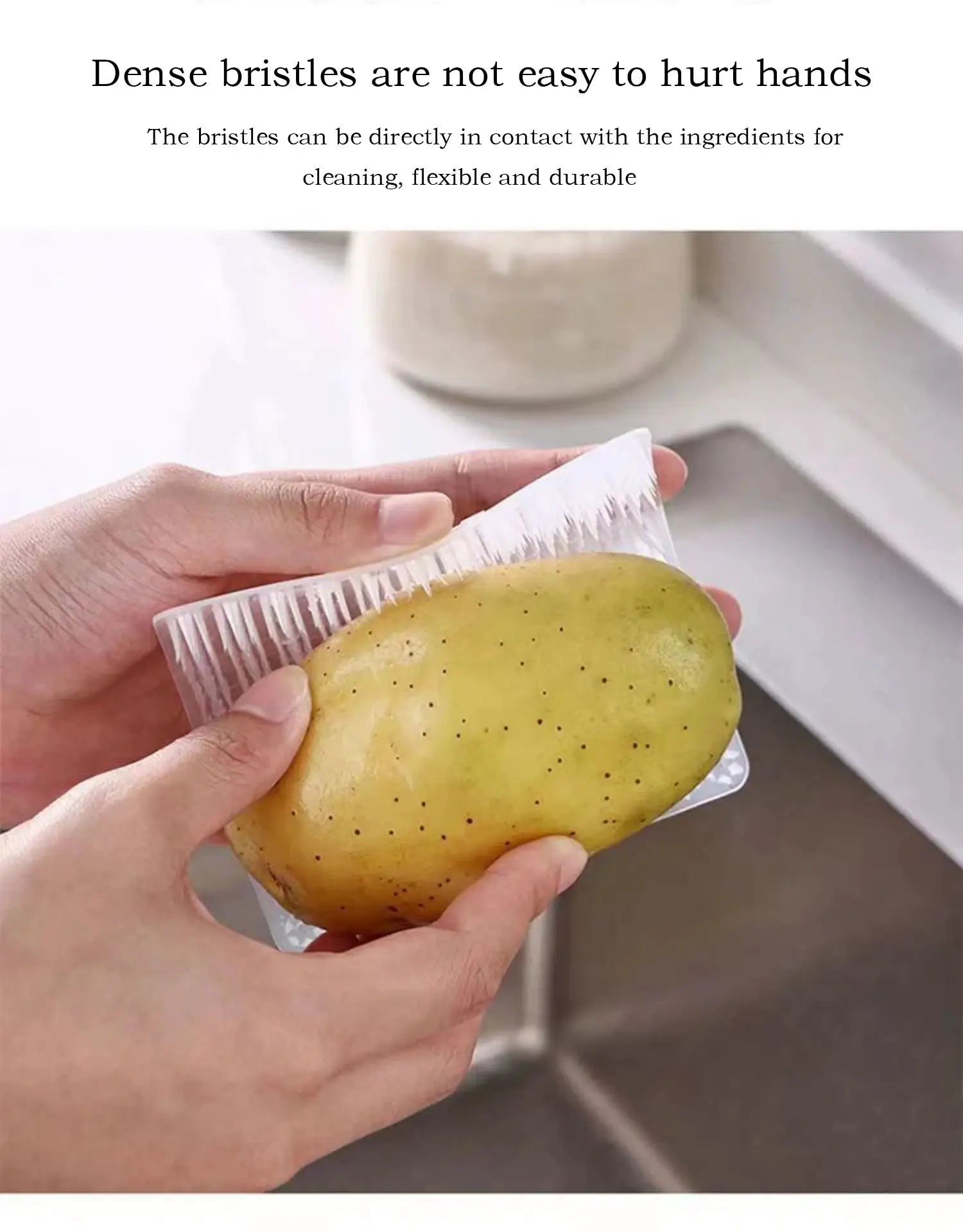 Silicone dish scrubber crevice brush for kitchen cleaning, compact with dense white bristles.