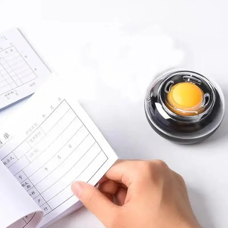Simples Market round money counting tool with stainless steel case and yellow center, beside a ledger page.