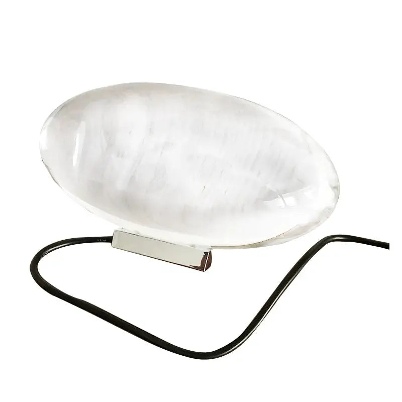 Egg-shaped LED crystal table lamp by Simples Market, clear marbled glass on a metal base with black cord