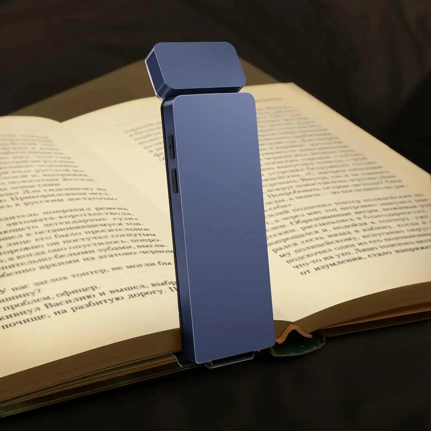 Simples Market blue LED clip-on book light with rechargeable power and foldable head for reading in bed.