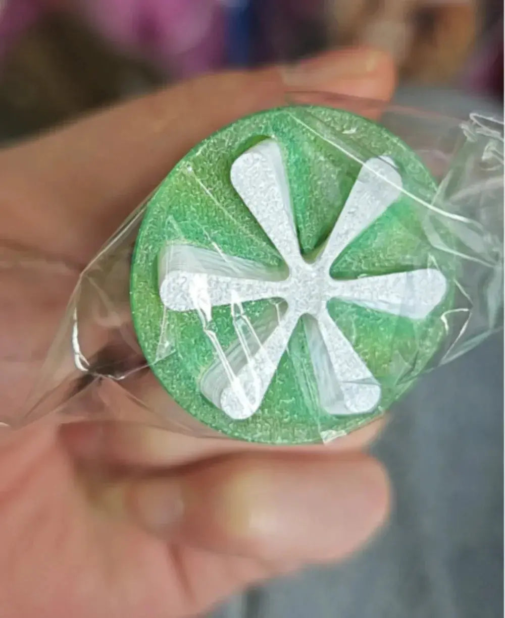 3D Printed Helix Screw Rotating Toy green disc with white geometric spiral design