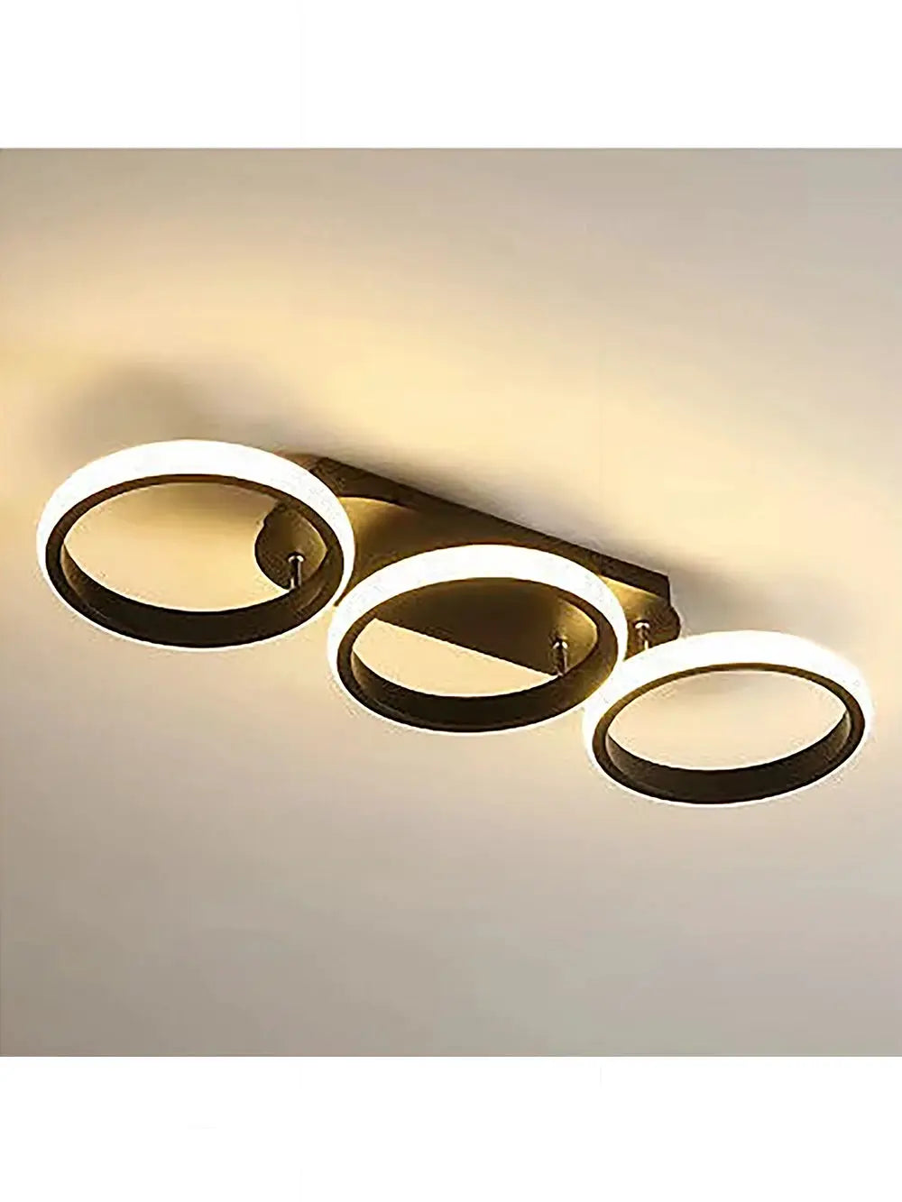 LED ceiling light with three illuminated circular rings on a dark rectangular base, modern luminaire