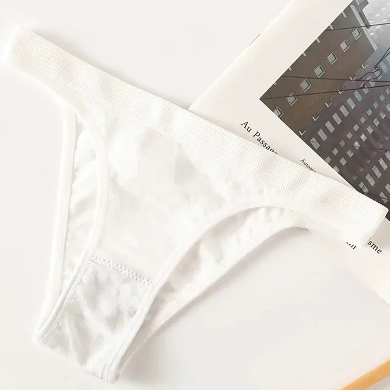 White women's thong underwear with cotton gusset and high-leg cut.