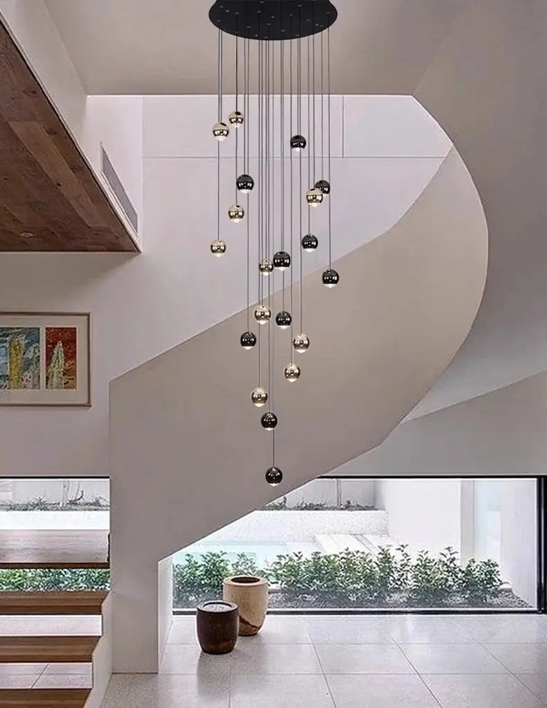Modern ring pendant light with LED spheres in gold and black, hanging cluster fixture.