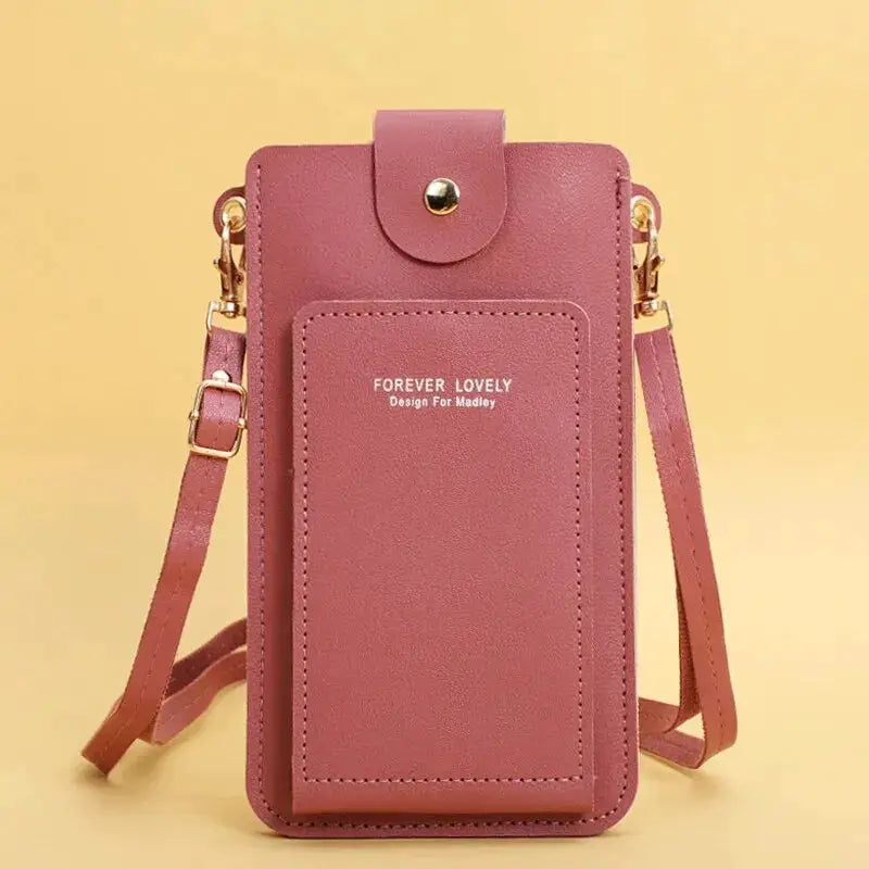 Forever Lovely pink faux leather crossbody bag with adjustable strap, front pocket and gold hardware