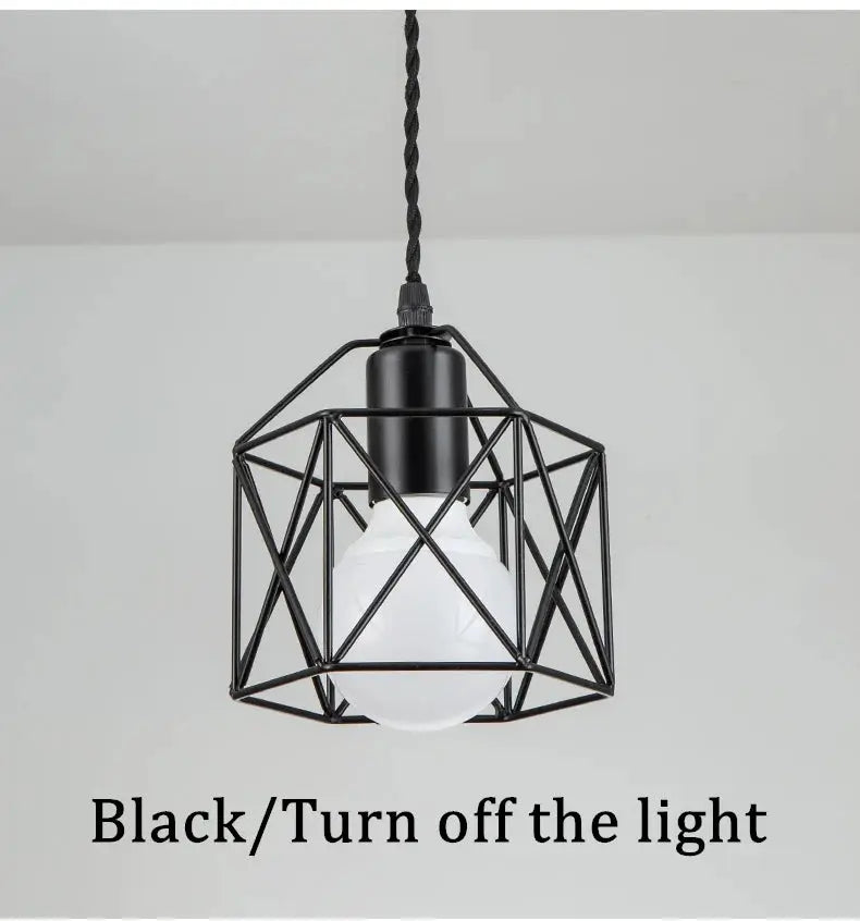 Modern LED pendant light with black geometric metal cage and white bulb by Simples Market