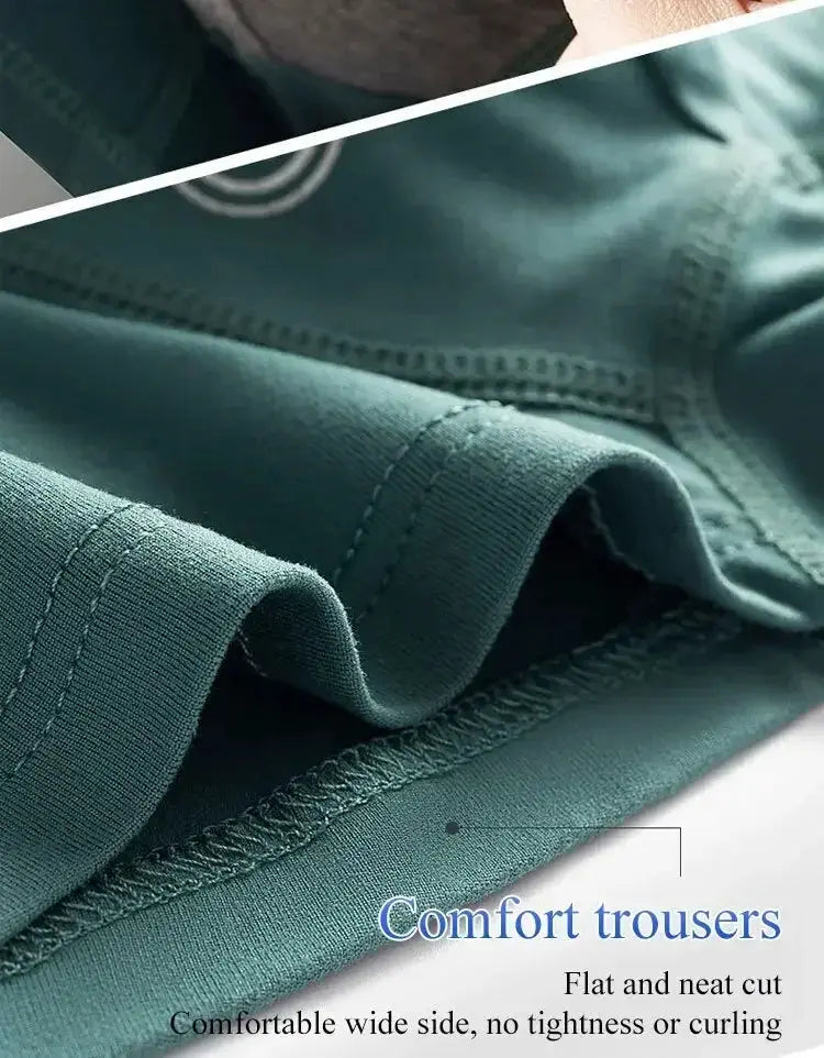 Men's boxer shorts in teal fabric, close-up showing neat stitching and folded hem