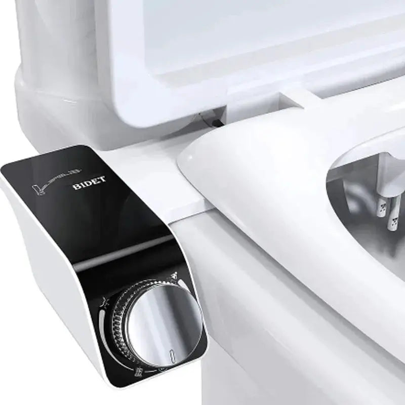 Bidet toilet seat attachment with dual nozzles, white with black control panel.