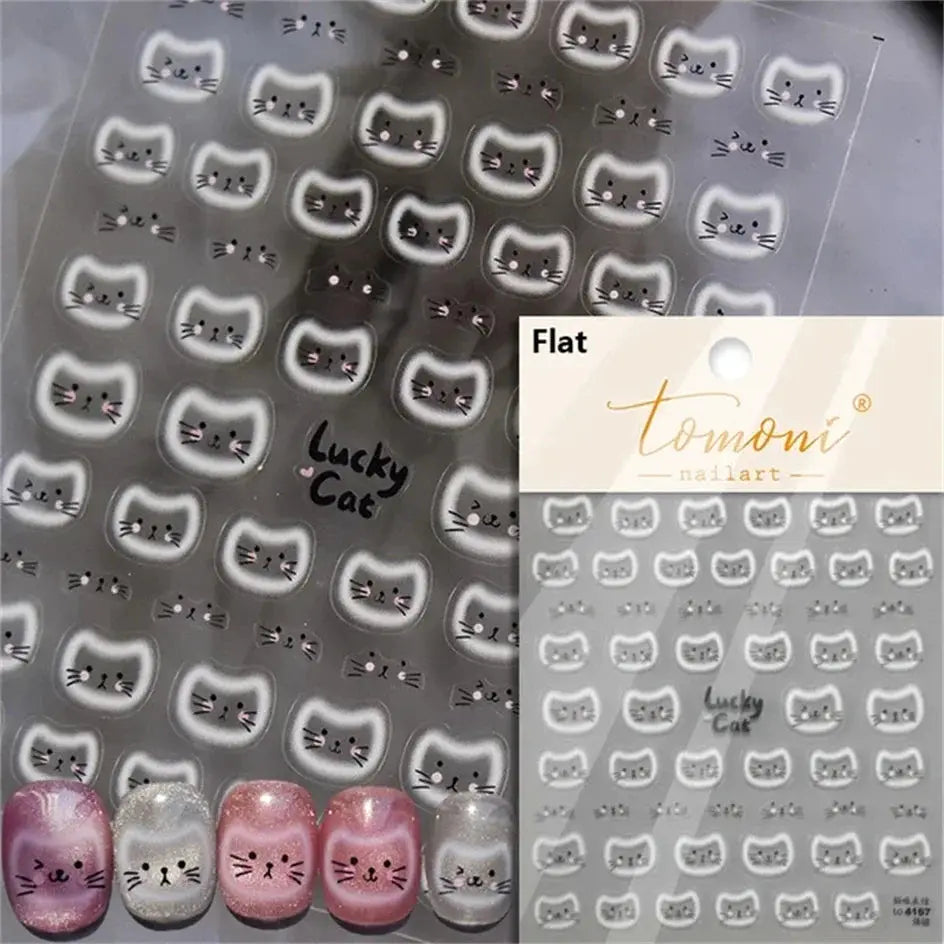 Cat-face nail art stickers sheet with white halo cat faces for pastel manicures; Tomoni nailart.