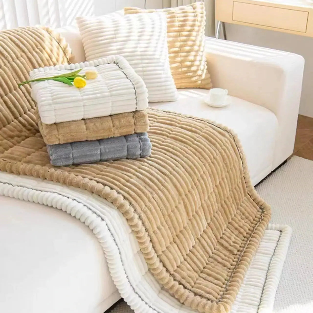 Thickened Quilting Warm Stripe Flannel Sofa Pad Set, 4-piece in white, beige, brown and gray on a white sofa.