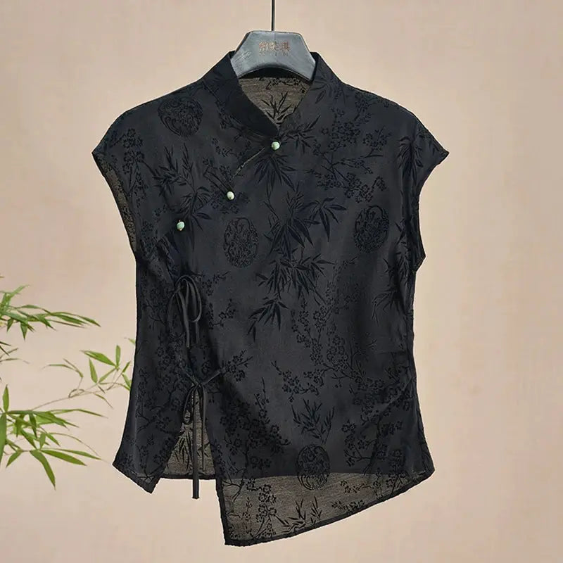 Cheongsam-style black jacquard top for women with mandarin collar, side tie, and short sleeves.