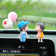 Car dashboard ornament: Simples Market cute cartoon two figurines with balloons, blue overalls boy and pinkdress girl