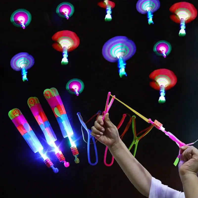 New Light Up Arrow Rocket Helicopter Flying Toys With LED Neon Glow For Parties And Gifts Rubber Band Catapult