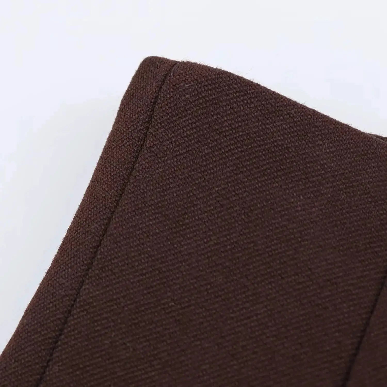 KONDALA blazer brown textured fabric close-up on shoulder seam.