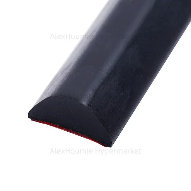 Simples Market shower water dam threshold, black curved rubber strip with red underside.