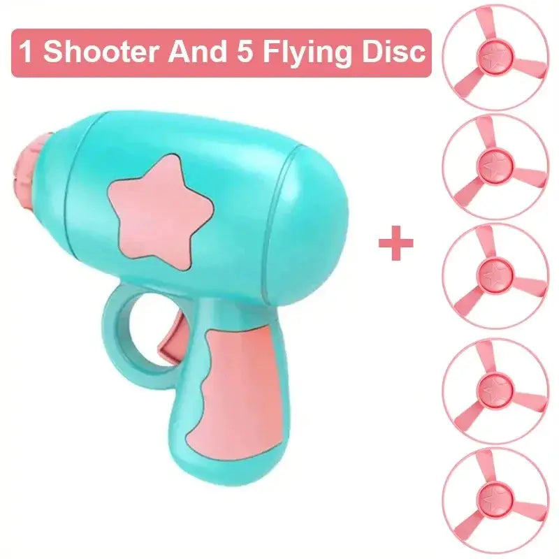 Cat launcher toy by Simples Market, turquoise with pink grip, includes 5 pink flying discs