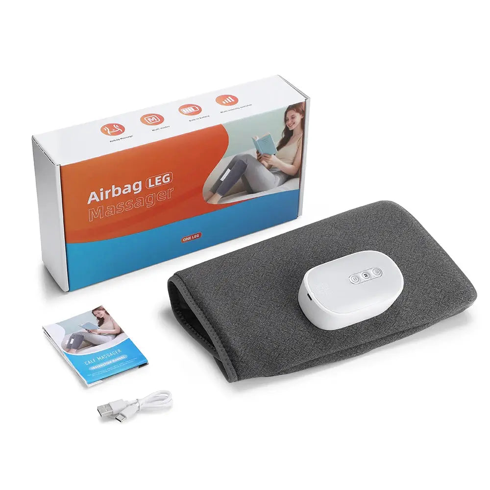 Calf massager wrap with wireless controller, gray fabric, USB cable and user manual beside the box