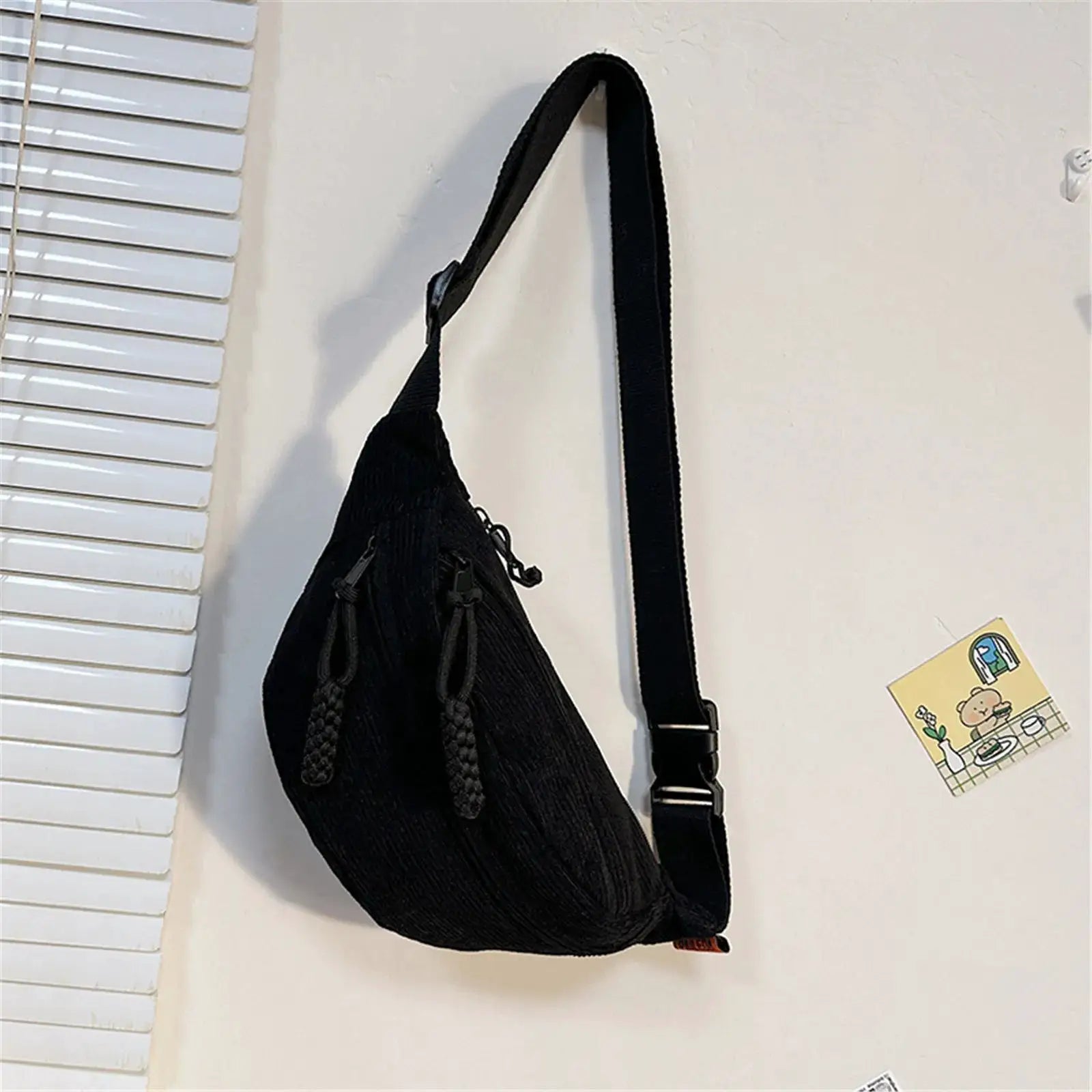 Simples Market corduroy belt bag in black with an adjustable long strap