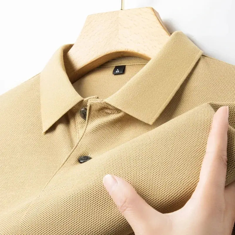 Men's beige cotton polo shirt with textured knit, polo collar, and button placket