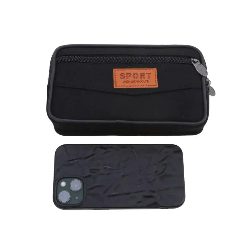 Simples Market black nylon waist pack bum bag with orange SPORT logo; includes smartphone for scale.