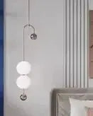 Nordic minimalist chandelier by Simples Market with three white globe lights in a bedroom.