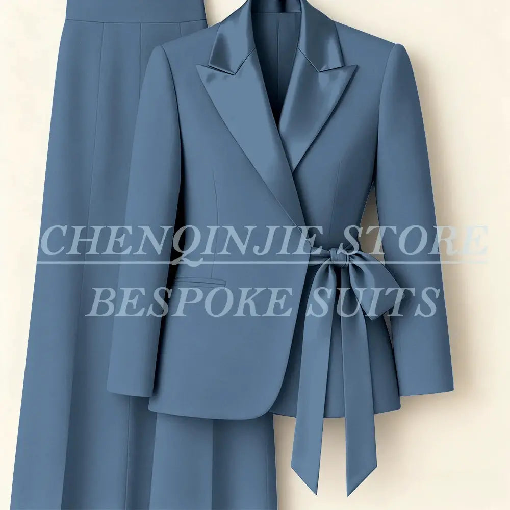 Women's blue 2-piece blazer suit with peak lapels and waist-tie belt, includes matching pants.
