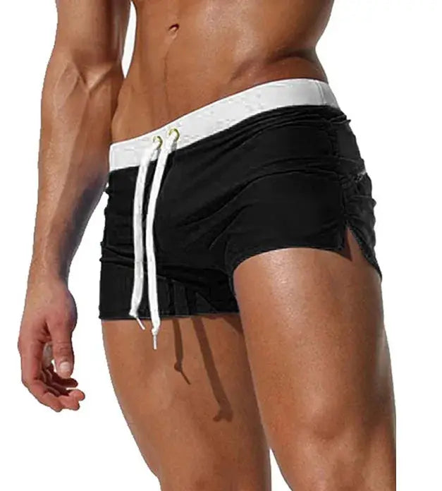 Men's black swim trunks with white waistband and drawstrings for quick-drying beachwear